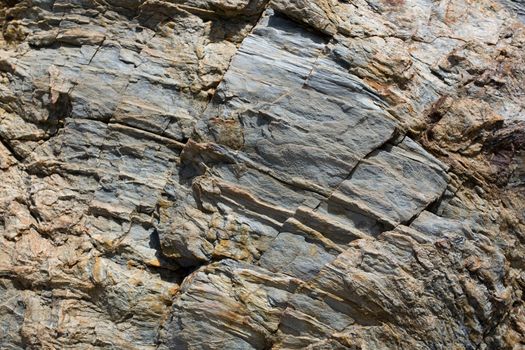 Rusty and gray striae on rock stone pattern, textured background