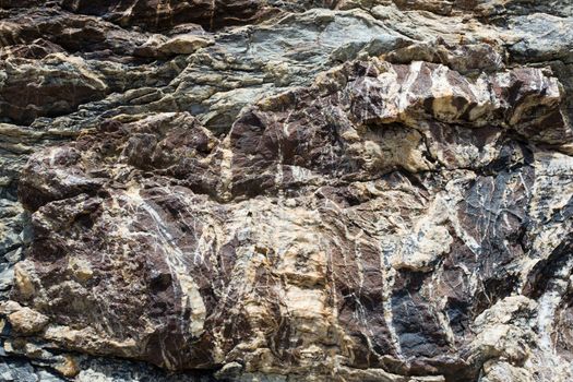 Dark brown with striae rock stone pattern, textured background