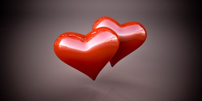 Shiny red hearts on a dark gray background, vignetting