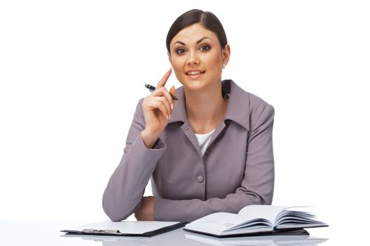 Portrait of a young attentive businesswoman with a pen and dairy over white.