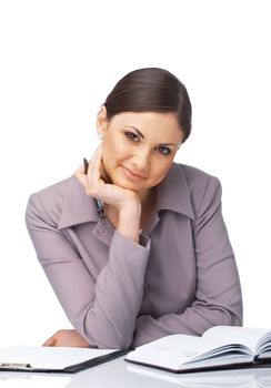 Portrait of a young businesswoman at the desk with her chin on the hand