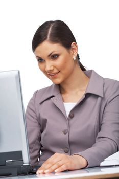 Business young woman sitting at her desk looking surprised on her laptop