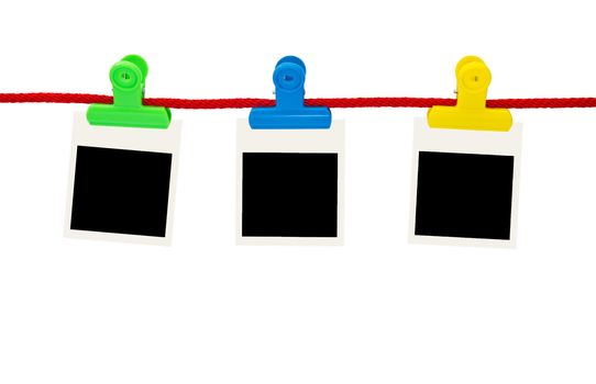 Blank photo frames Hanging by plastic peg on white background