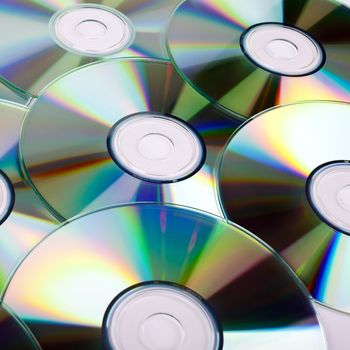 CDs (Compact Discs) laid out on a white background.