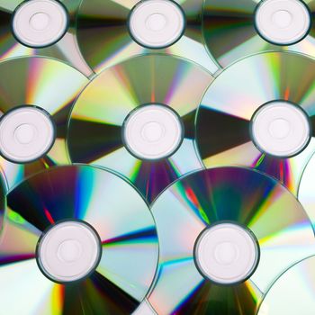 CDs (Compact Discs) laid out on a white background.