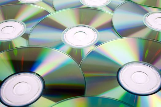 CDs (Compact Discs) laid out on a white background.