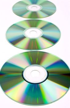 CDs (Compact Discs) laid out on a white background.