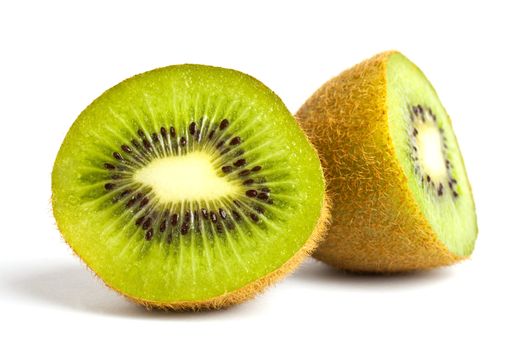 A Kiwi Fruit cut in half over a white background.
