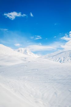 Snow mountains on bright winter day