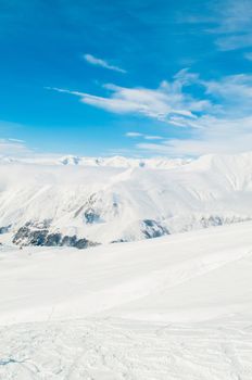 Snow mountains on bright winter day