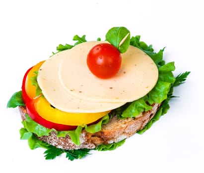 sandwich with ham,cheese and vegetables on white background