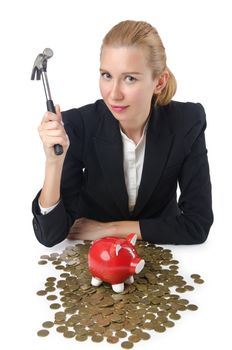 Woman breaking piggy bank for savings