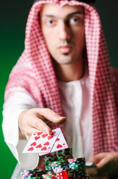 Arab playing in casino - gambling concept with man