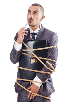 Businessman tied up with rope