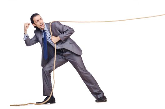 Businessman pulling rope on white