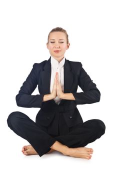 Young businesswoman meditating on the white