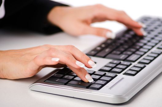 Hands working on the keyboard