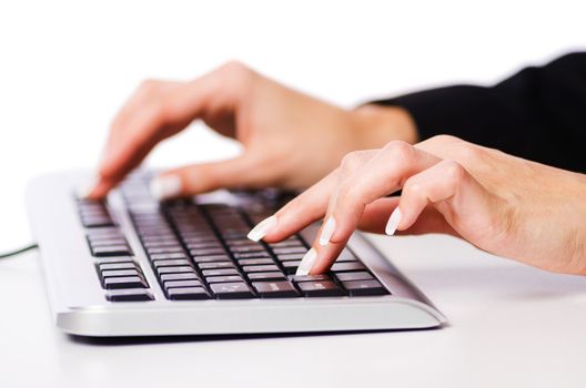 Hands working on the keyboard