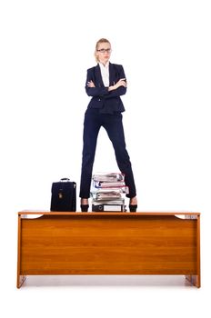 Dominant woman boss standing on desk