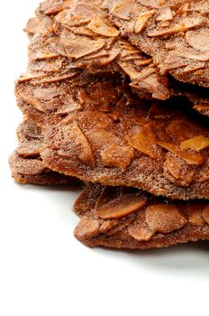 Stack of Almond Thin Crunchy Pastry closeup on white background