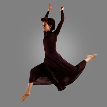 dancer on a gray background , motion