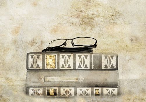 Books and glasses on a textured background