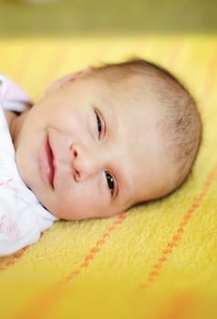 beautiful two weeks old baby girl smiling