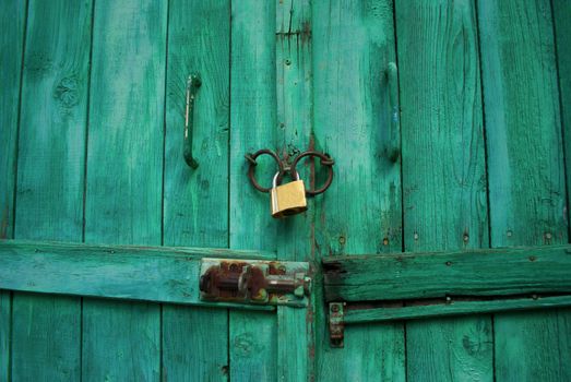 Locked wooden door with padlock