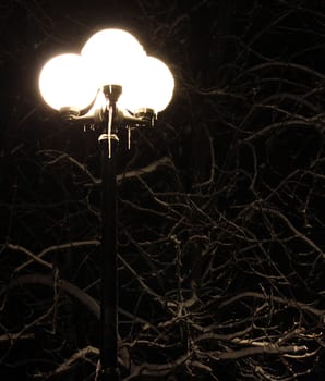 lantern with icicles at winter night