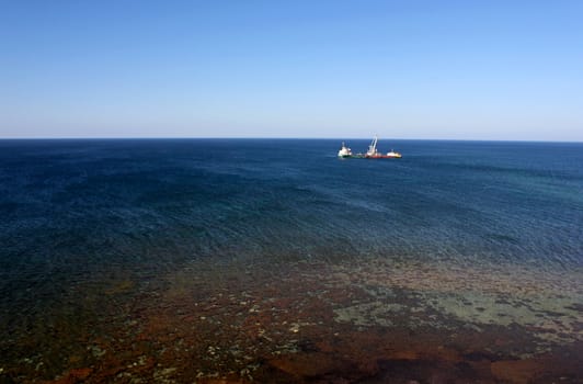 view on sea with ship run aground