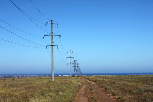 row of electricity pillons at countryside