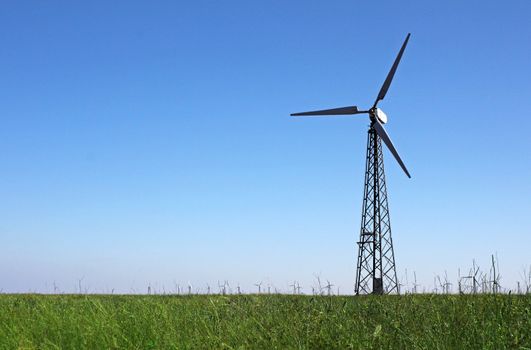 wind turbine over blue sky