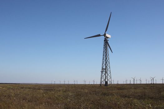 wind turbine over blue sky