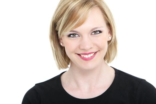 Studio shot of an attractive blonde woman smiling directly to the camera, isolated on white