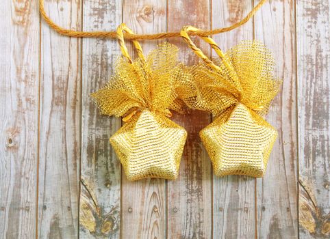 Christmas decoration hanging over wooden background 