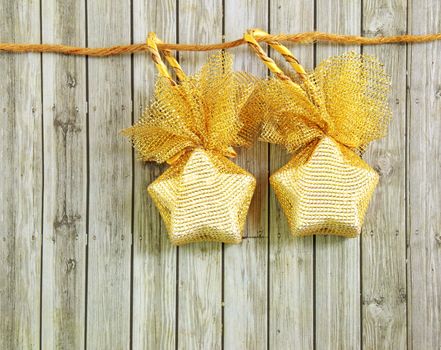 Christmas decoration hanging over wooden background 