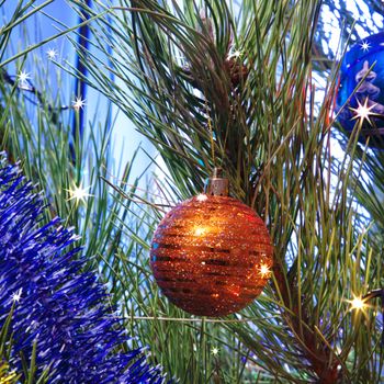 Decorated Christmas tree with bulbs and sparks