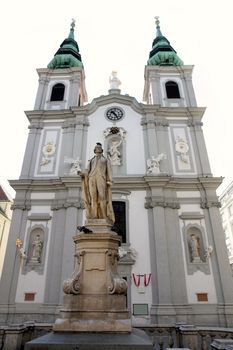 The Baroque Church of Mariahilf and statue of musician Franz Joseph Haydn in Vienna, Austria