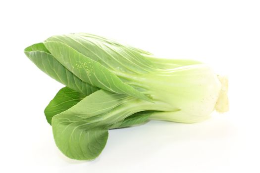 raw crisp white and green pak choi on a light background