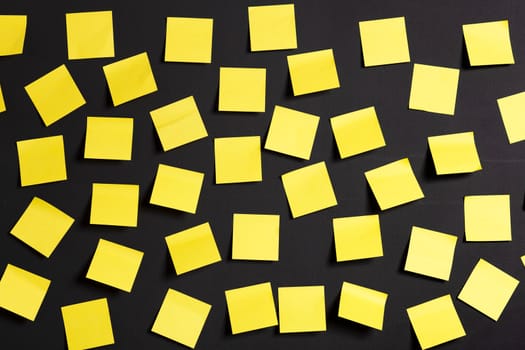 Background image of yellow notes on a black board