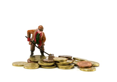 man with broom brushes euro coins together