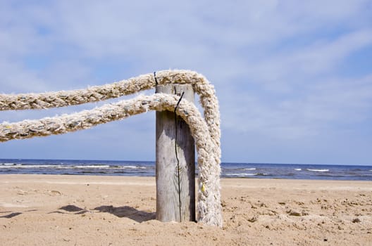 original ropes fence on summer resort sea beach