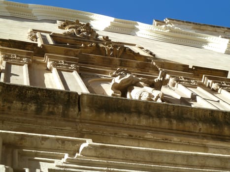 church front carvings with bright blue sky