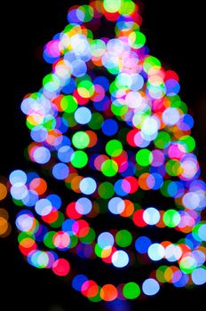 blurred christmas tree lights on a black background