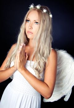 Portrait of a blonde in white Angel costume 