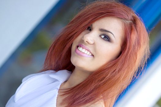 Red Hair girl smilling at the camera