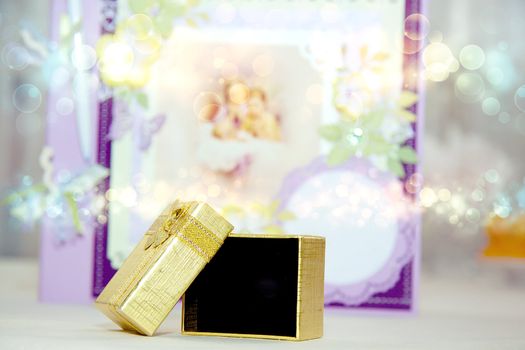 A close up of a gold gift box