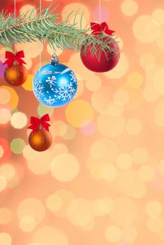Christmas colorful festive background with balls on ribbon and, holiday card, place for holiday text
