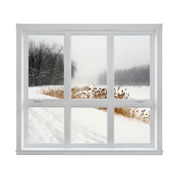Snowy winter landscape seen through the window.