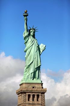 Statue of Liberty on Liberty Island in New York City. - isolated on blue sky background